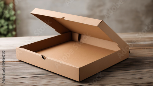 Cardboard pizza box mockup opened with minimal branding on wooden table, food delivery concept