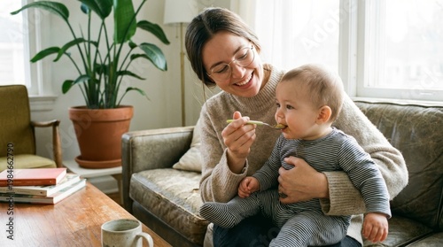 Mother Feeds Baby with a Spoon in Relaxing Home Setting