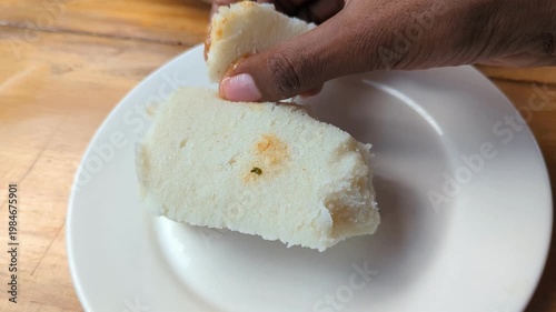 Ugali with Fish Stew in Slow Motion Video, Kenyan Cornmeal Staple Served with Spiced Fish Curry Traditional Food Scene
