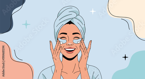 Happy woman with a towel on her head applying cosmetic eye patches as part of her morning skincare routine.