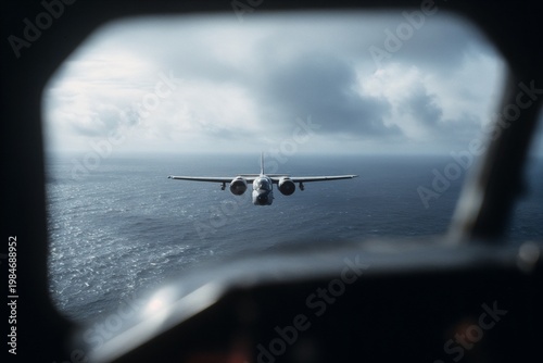 Airplane flying over ocean viewed from cockpit window