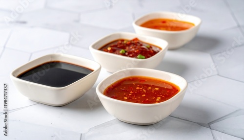 Assortment of Asian Dim Sum Dipping Sauces in Ceramic Dishes
