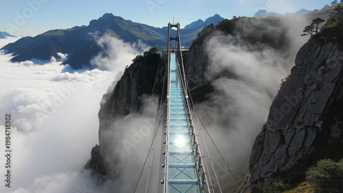 Long Glass Suspension Bridge Across a Mountain Gap With Clouds Drifting Beneath Majestic Peaks