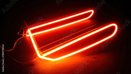 Brightly Glowing Neon Gas Discharge Tube Emitting Vibrant Orange-Red Light, a Striking Visual Display of Energetic Illumination.