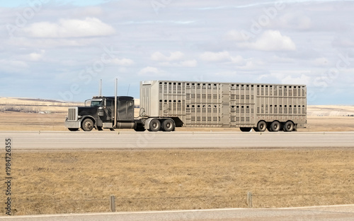 Heavy Cargo on the Road. A truck transporting cargo along a highway. Taken in Alberta, Canada