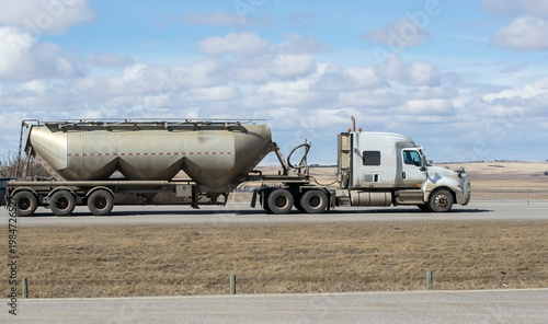 Heavy Cargo on the Road. A truck transporting cargo along a highway. Taken in Alberta, Canada