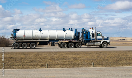 Heavy Cargo on the Road. A truck transporting cargo along a highway. Taken in Alberta, Canada