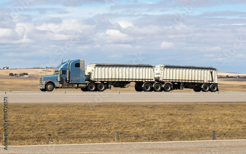 Heavy Cargo on the Road. A truck transporting cargo along a highway. Taken in Alberta, Canada