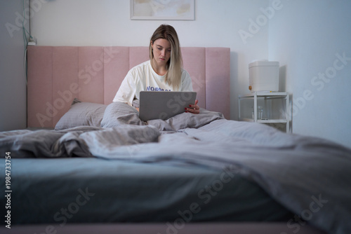 Focused Morning Work from Bed in Soft Daylight