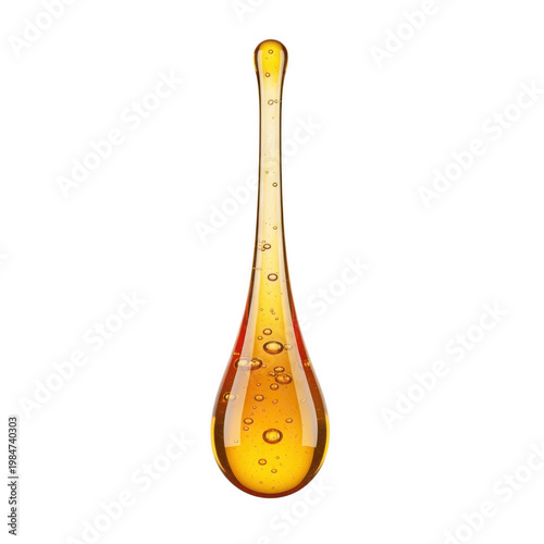 A single elongated drop of golden honey or viscous syrup with small air bubbles inside the liquid