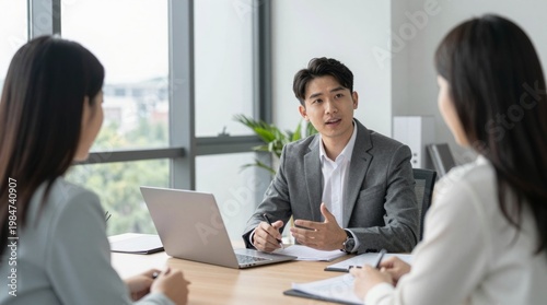 Business Meeting with Young Professionals in Modern Office Space