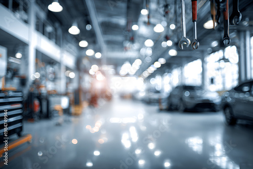 Blurred Background of a Modern Automotive Repair Shop with Tools and Vehicles.