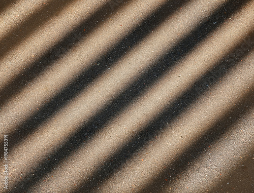 Foto Diagonal light rays on the street asphalt background