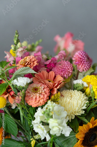 Vibrant mixed bouquet with zinnias, chrysanthemums, and sunflowers