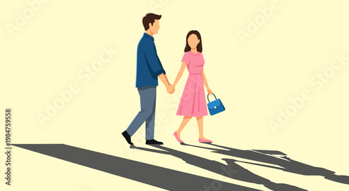 Young couple walking hand in hand together with long shadows.