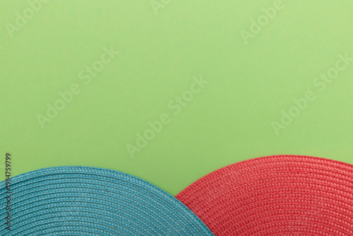 Neutral woven semicircle textile on muted green background with clean negative space