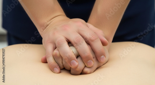 Medical Professional Performing CPR Compressions on Training Mannequin