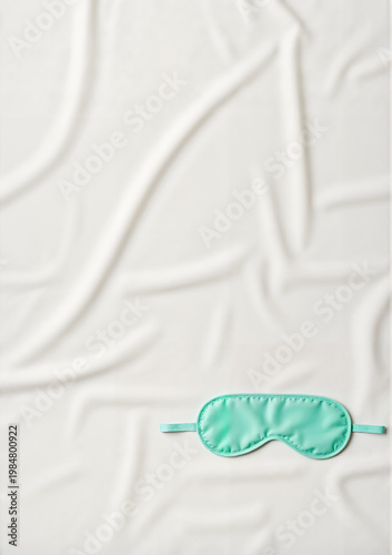 Sleep mask on soft background symbolizing Health Day  