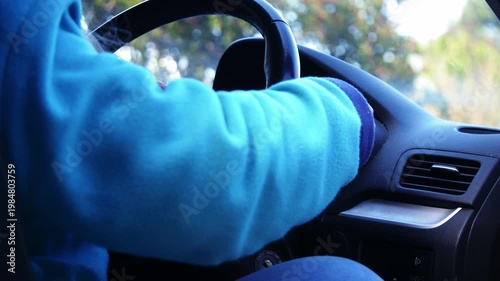 Woman gets into drivers seat of car 