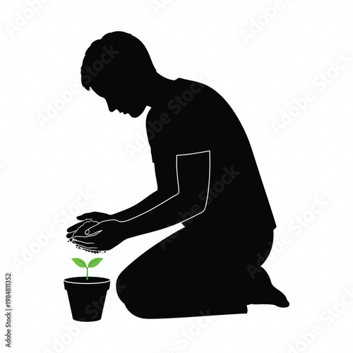 Silhouette of a man planting a small seedling in a pot for gardening and nature conservation