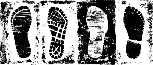 set of four black grunge footprint silhouettes with various sole patterns on white background