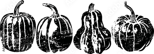 Four decorative pumpkins in various shapes and sizes with textured dark shading