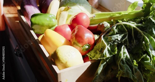 Wooden crate sitting on kitchen counter, camera shifting and sun rising, showing tomato textures