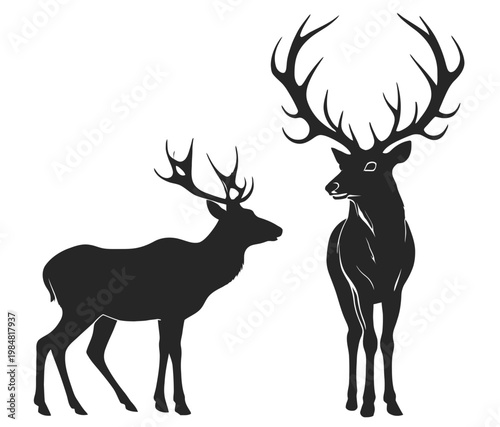 Two deer with large antlers standing facing each other in black silhouette