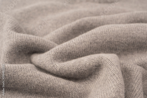 Soft grey merino wool sweater texture as a background.