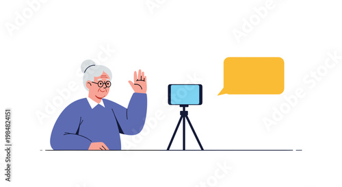 Elderly woman with grey hair sits at a desk and waves happily at a smartphone camera during a video call session with a speech bubble.