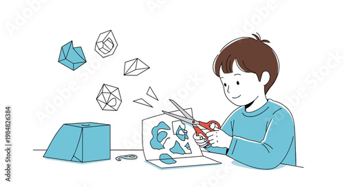 Creative young boy happily engaged in a paper craft activity by cutting out various geometric shapes from a sheet of blue paper.