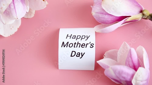 fresh blooming magnolia flowers on pink background with copy space