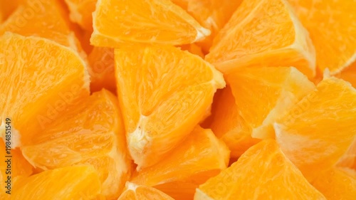 Heap chopped orange fruit, rotation. Natural healthy snack ideas