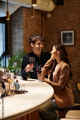 Картината върху платно Couple celebrating love and connection at a cozy restaurant