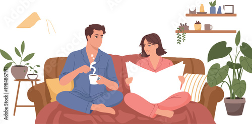 Couple relaxing on sofa, reading newspaper and drinking coffee.