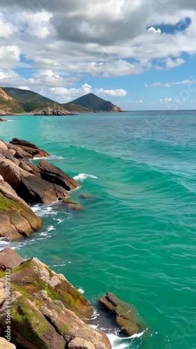 Seaside reefs and blue sea scenery, waves crashing on the reef landscape