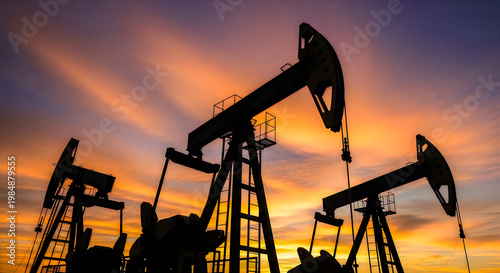 Oil pumpjack silhouette at sunset energy industry and resource extraction scene