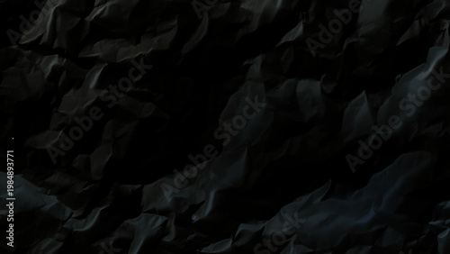 Dark grey rocky surface with craters and uneven terrain in space rough texture