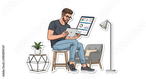 man sitting on stool with laptop and smartphone at home