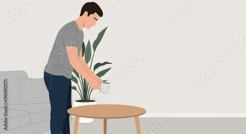 Man watering a houseplant on a coffee table in a modern living room