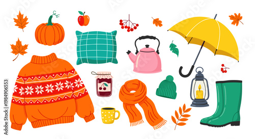 Cozy autumnal items arranged with sweater pumpkin leaves and tea for fall atmosphere