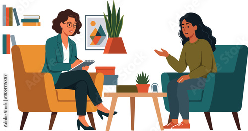 Two women in a therapy session sitting in armchairs talking and taking notes