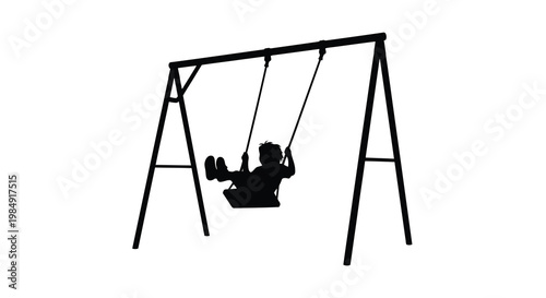 Silhouette of a child swinging on a simple metal swing set