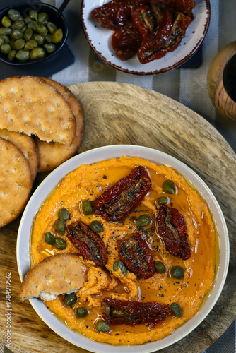 Hummus with sun-dried tomatoes and capers
