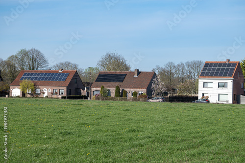 Residential houses with solar panels in rural Geel