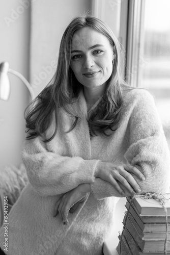 Portrait of young redhead woman with freckles in studio. Sensual expressive happy woman
