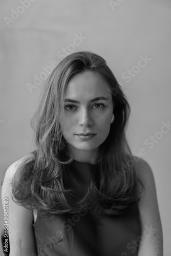 Portrait of young redhead woman with freckles in studio. Sensual expressive happy woman