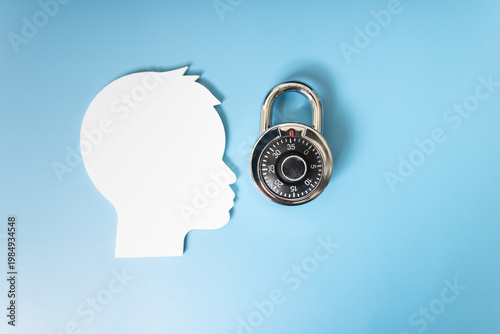 Concept of mental block, silhouette of a person with a closed padlock symbolizes that there is an obstacle