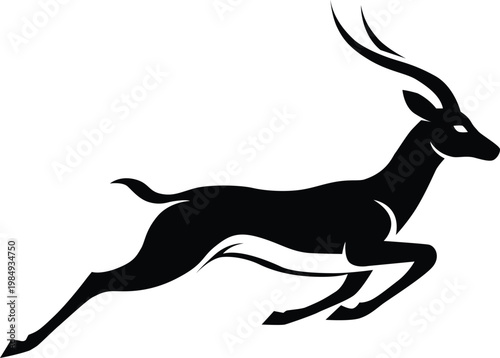 A striking black silhouette of an impala in mid leap