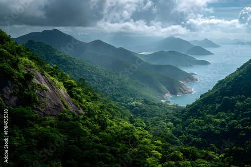 Lush Brazilian landscape featuring dense green vegetation, rolling hills, and a coastal view under a cloudy sky with distant mountains in the background
